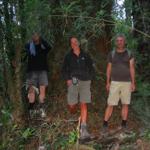 Tommy, Laura and Alfred in front of a huge trunk of an Alerce tree